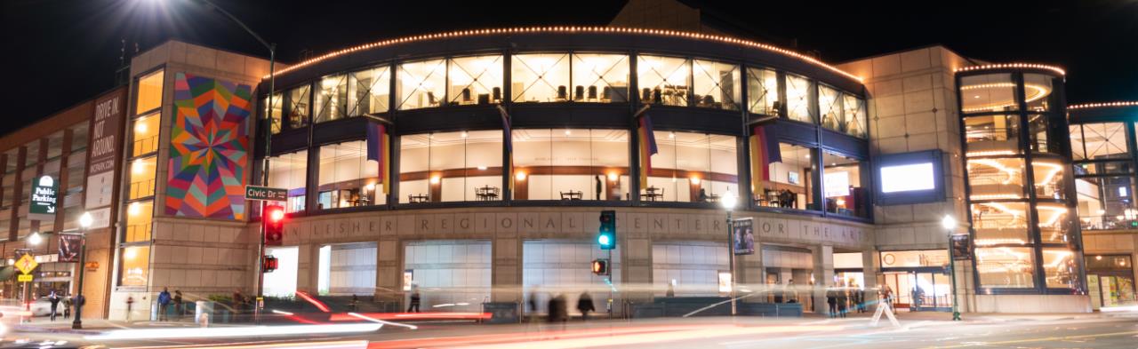 Lesher Center for the Arts exterior at night with speeding cars